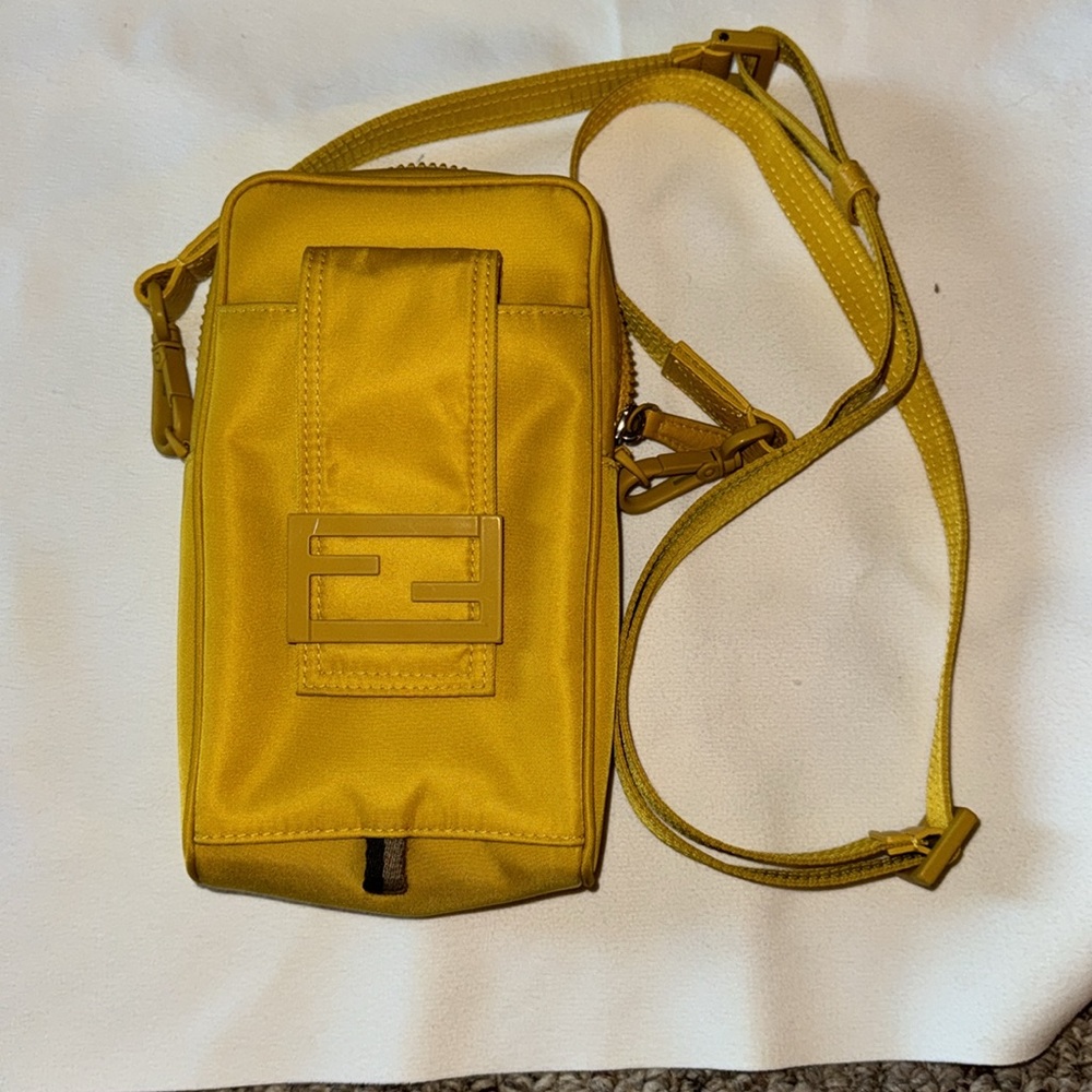 Fendi phone pouch is EUC. Yellow. Authentic.